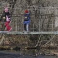 Cassidy Mentink, 9, left, of Lyons, Neb., and her cousin, Ethan Koranda, 8, of Mitchell, Neb., walk ...