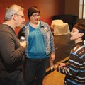 Mitchell Gold signs a copy of his book for Judith Levine at the Fayetteville Public Library on Dec. ...