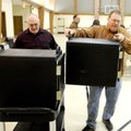 SOUP'S ON
World Garden owner Rick Boosey, right, carries an insulated box containing pots of variou...