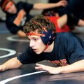 Rogers Heritage’s Cole Bundy hits the mat Saturday while practicing swith the wrestling team.
