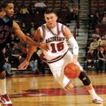 Arkansas guard Rotnei Clarke brings the ball up the floor against Delaware State’s Greg Smith during...