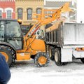 Bentonville Water Department employee Tom Barrentine waits Sunday while Guy McKenzie loads his dump ...
