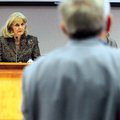 Vicki Thomas, Fayetteville school board superintendent, listens as Gary Jackson with Hight-Jackson A...