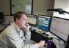   Chris Braithwaite, communication specialist, at his console in the communication's center at Arkansas Children's Hospital in Little Rock, Dec. 31. ACH has received $281,438 in CSEPP money since 2005. It was used to purchase a communications system at the hospital.