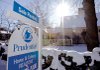 A sign marks a house for sale in Andover, Mass., in December. The number of buyers who agreed to purchase a previously owned home fell sharply in November.