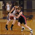 Fayetteville’s Tenille Briney, left, battles with Ponca City’s Jordan Hull for possession of the bal...