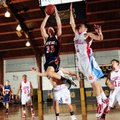 Rogers Heritage’s Miles Johnson, left, takes the ball to the basket under pressure from Webb City, M...