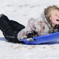 Matt Many, 9, sleds down the hill at Lingle Middle School in Rogers on Monday. Rogers schools were c...
