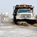 An Arkansas Highway and Transportation Department plow clears snow and ice Tuesday morning from the ...