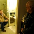 Bryan Johnson, left, with Mayes Plumbing and Heating, talks with homeowner Cleon Gentry about freezi...