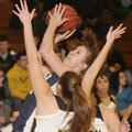 Shiloh Christian’s Lindsey Roe takes a shot while Prairie Grove’s Elysia Clement defends Tuesday.