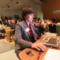 Tara Smith, Arkansas Department of Higher Education coordinator for financial aid, demonstrates the ...