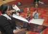 WARMTH IN THE WRITTEN WORD: Sue Ann Pekel, children’s librarian at the Bentonville Public Library, reads the book “Llama Llama Red Pajama” during storytime Wednesday.
