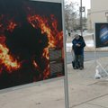 FIRE AND ICE: Henry Cathey of Camden walks Wednesday near the student union of the University of Ark...
