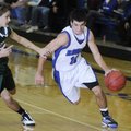 Rogers High’s Wyatt Hively drives the ball past Mt. Vernon’s defense in the first half of a Dec. 11 ...