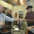 Rogers city employee Mike Rouse, left, serves chili Thursday to Loyd Shaffer and his brother, Howard...
