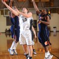 West Fork junior Jared Johnson scores as Subiaco Academy’s Keon Walters, right, and Michael Osepa de...