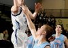 Springdale Har-Ber senior Matt Toomer, left, takes a shot over Fort Smith Southside senior Brent
Neeley during the first half Saturday at Har-Ber.
