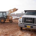 ON SCHEDULE, UNDER BUDGET
Work continues Friday on the new Siloam Springs High School during the da...
