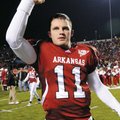 Arkansas quarterback Casey Dick waves to Razorbacks fans in War Memorial Stadium in Little Rock on N...