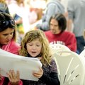 Shelby Ogle, 8, gets some help from her mother, Robin Tackett of Springdale rehearsing her lines Sat...