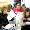 Haley Self, 9, and Hadley Biggs, 11, both of Rogers, rehearse their lines Saturday before auditionin...