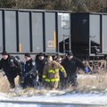 Fayetteville emergency personnel carry the body of Lina Waldrip out of the woods south of Martin Lut...