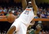  Syracuse's Arinze Onuaku (21) dunks against South Florida's Jarrid Famous during the second half of an NCAA college basketball game in Syracuse, N.Y., Sunday, Jan. 10, 2010. Syracuse won 82-65. 