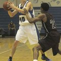 Rogers High’s Josh Anderson looks for a teammate during a Dec. 19 game against Sherman, Texas, in Ro...