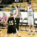 Bentonville Black guard Whitney Fraire shoots a 3-pointer over Bentonville Gold’s Kate Lacina during...