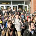 Bentonville High School students pour out of the north campus building after school Monday. With the...