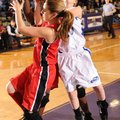 Fayetteville Woodland’s Maggie Stehlik, right, attempts to shoot as Fayetteville Ramay’s Brit Austin...