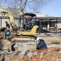 Crews with the city of Rogers and Multi-Craft Contractors work at Eastside Elementary School in Roge...