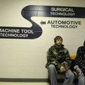 Levi Hardaway, left, of Avoca and Cody Dodson of Goshen wait in line Monday during open registration...
