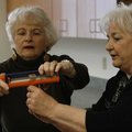  Arkansas Democrat-Gazette --1/12/10-- Dee Wissman of Rogers (left) gets help from instructor Bettie...