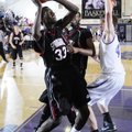 Springdale High’s Curtis Evans shoots the ball as Fayetteville High School’s Bo Renner defends in th...