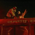 TANKER TREATED
Members of Gravette’s Fire Department add the chemical F-500 to the contents of a wa...