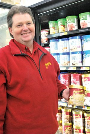 Michael Hawthorn of Hot Springs checks out the inventory of Yarnell’s Ice Cream at a Batesville grocery store. Hawthorn started out with the company as a route salesman 23 years ago and now works in pre-sales.