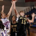 Bentonville Gold’s Kate Lacina reaches for a rebound in front of Springdale George’s Maranda Hefflin...