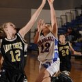Springdale George’s Victoria Smith, right, shoots over Bentonville Gold’s Taylor Lee in the first ha...