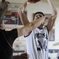 Fayetteville’s Jacob Baxter shoots the ball over a Springdale High defender during the first half of...
