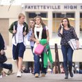 Fayetteville High School students exit the school at the end of the day Thursday and head to the sch...