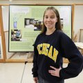 Terrilyn Wendling, curator of collections at the Rogers Historical Museum, stands next to the organi...