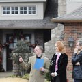 Real estate agent Austin Bivens, left, shows prospective buyers Judy and Craig Bratten the Arkanshir...