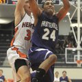 Fayetteville’s Taylor Cochran is fouled by Rogers Heritage’s Miles Johnson while Cochran tries to co...