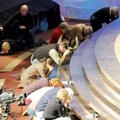 Worshippers quietly humble themselves in a Solemn Assembly at the Church at Pinnacle Hills in Rogers...