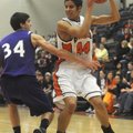 Rogers Heritage’s Jon Warner, right, tries to work around Fayetteville defender Jacob Baxter during ...