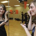 A TOUCH OF COLOR
Ashleigh Alecusan, Heritage High School’s Colors Day Queen, touches up her makeup ...