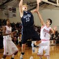 Springdale Har-Ber’s Chris Bayles, center, takes the ball to the basket between Bentonville’s Mytaah...