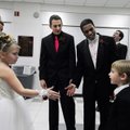 COLORS DAY Abbey Ott, 6, left, holds out her hand Friday to Jack Baldwin, 4, right, as Springdale Hi...